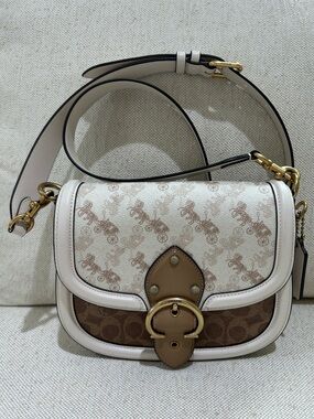 Coach Signature Horse and Carriage Beat Saddle Bag Crossbody Chalk Tan C3837